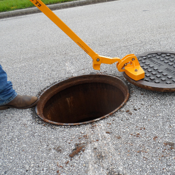 Magnetic manhole lid remover